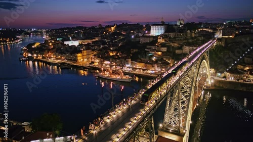 Wallpaper Mural View of illuminated Porto city and Douro river and Dom Luis bridge I from famous tourist viewpoint Miradouro da Serra do Pilar in evening twilight with metro tram. Porto, Vila Nova de Gaia, Portugal Torontodigital.ca