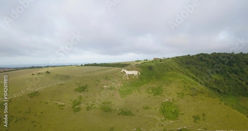 Aerial view of Litlington White Horse chalk hill horse figure in the South Downs, England UK, Pull in and down view photo