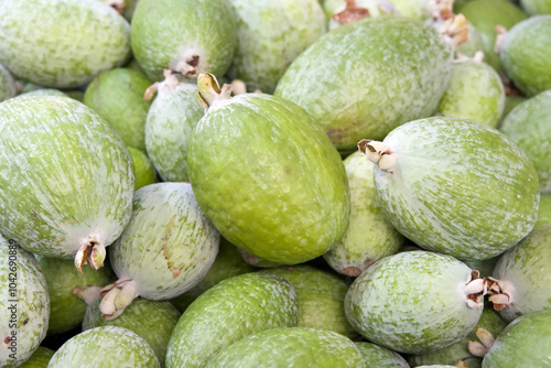 Close up on a pile of fresh ripe Feijoa sellowiana also known as Acca sellowiana Burret or Pineapple Guava.