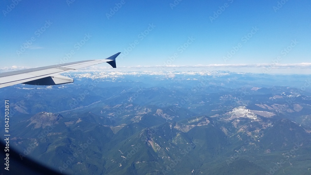 Flying into Seattle, View from the Plane Window, Pacific Northwest Mountains Flying into Seattle, View from the Plane Window, Pacific Northwest Mountains