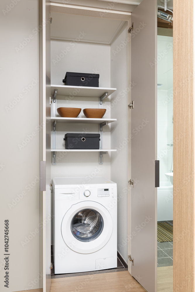 home laundry room with modern washing machine, shelving unit home laundry room with modern washing machine, shelving unit