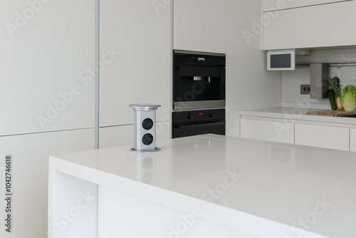 Pop up electrical socket on kitchen worktop.