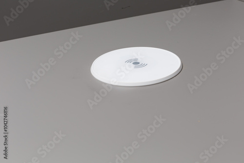 Wireless Charging Pad on kitchen worktop table photo