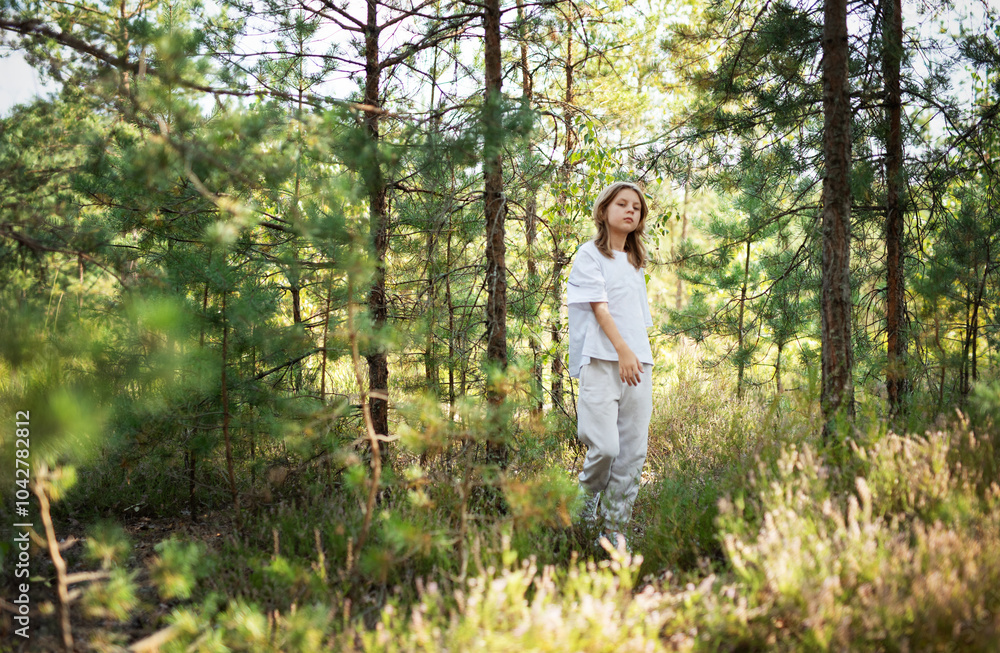 A child exploring a serene forest trail on a sunny day, surrounded by lush trees and greenery in nature's beauty A child exploring a serene forest trail on a sunny day, surrounded by lush trees and greenery in nature's beauty