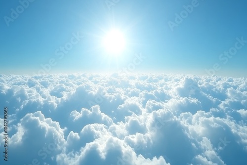 A breathtaking view of fluffy white clouds beneath a bright blue sky, with the sun shining brightly in the distance.