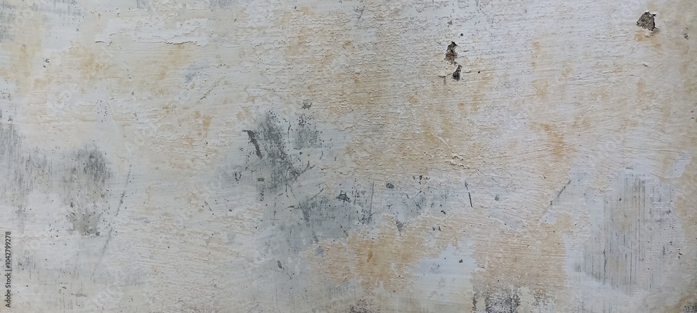 Fototapeta premium Peeling Paint on Aged Wall with Distressed Texture. A weathered wall with peeling paint and distressed texture, ideal for grunge or vintage designs