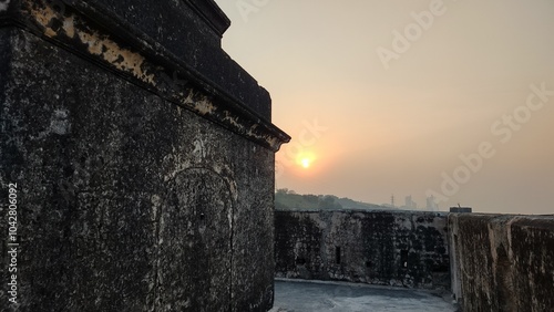 winter sunset over the ancient temple 