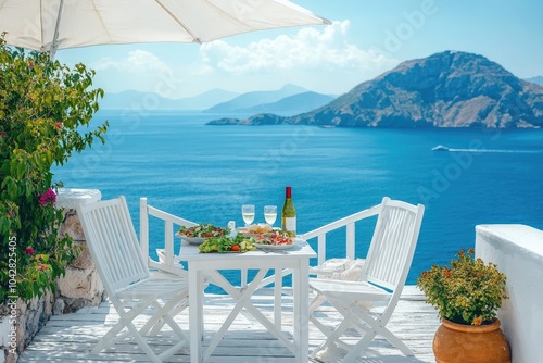 Romantic dinner setting overlooking beautiful blue ocean on sunny day photo