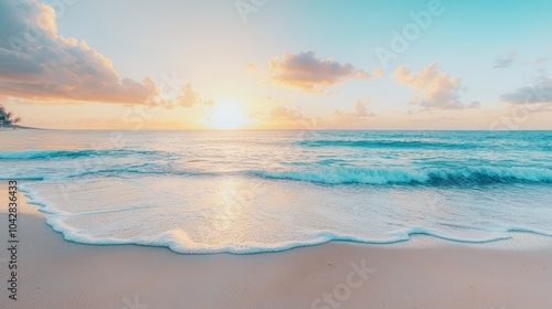 A serene beach scene at sunset, showcasing soft waves lapping the shore under a pastel sky filled with clouds.