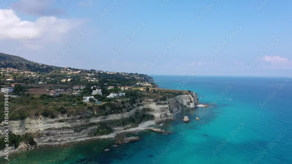 Aerial view of the coastline, sea and sandy beaches of Tropea on a sunny summer day in Calabria, Italy Aerial view of the coastline, sea and sandy beaches of Tropea on a sunny summer day in Calabria, Italy