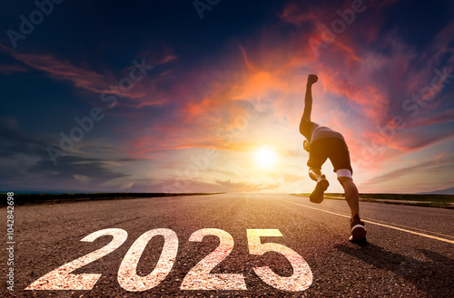 Fotografija Young man running and sprinting on road with 2025 new year concept