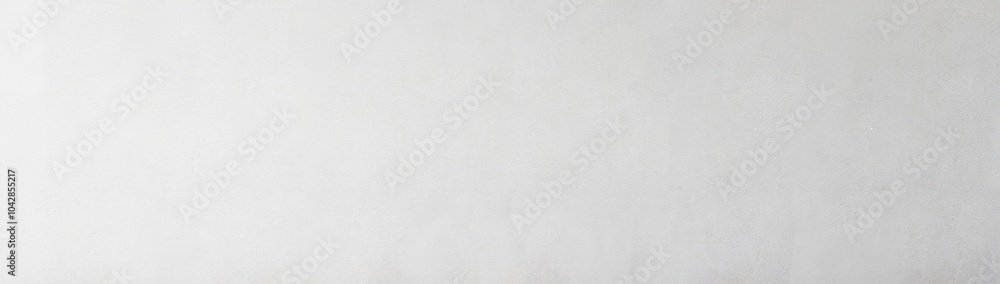 Fototapeta premium Smooth light gray wall texture with subtle gradient, ideal for background or design elements.
