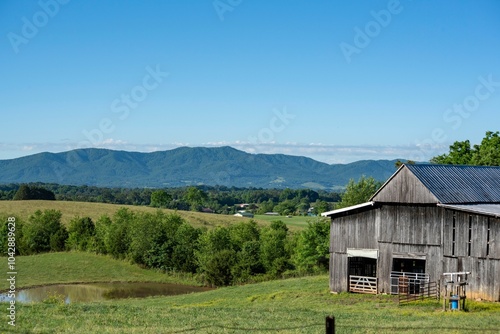 Rural landscape with barn and mountains