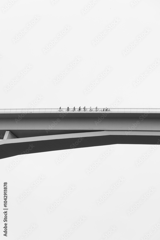 Cyclists crossing a bridge in the city of Porto, Portugal Cyclists crossing a bridge in the city of Porto, Portugal
