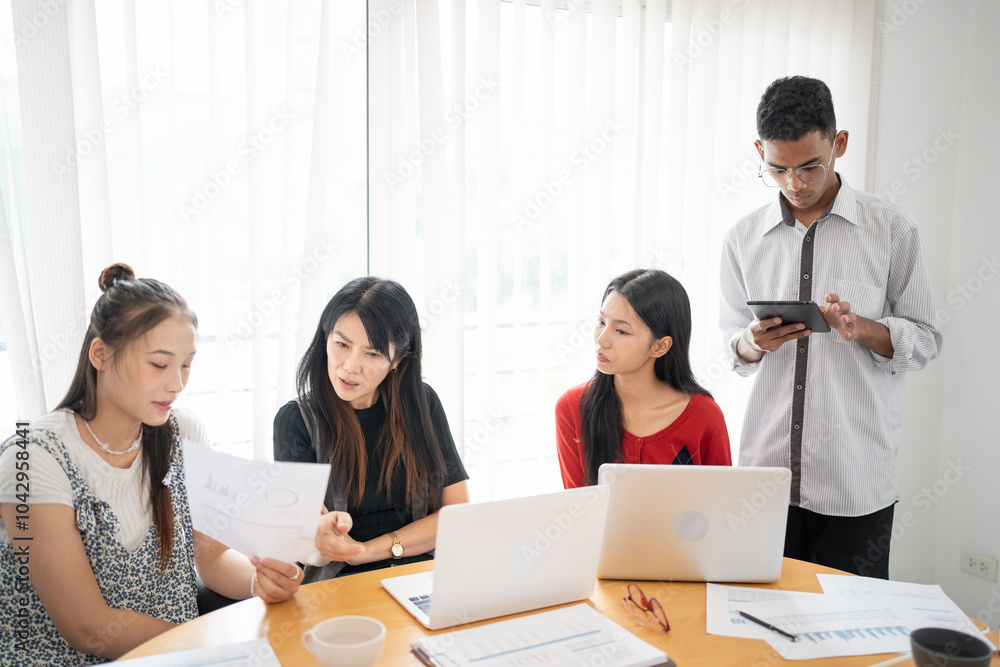 Business people group diverse colleagues team discuss project in bright modern office Startup Diversity Teamwork Brainstorming. Business people group diverse colleagues team discuss project in bright modern office Startup Diversity Teamwork Brainstorming.