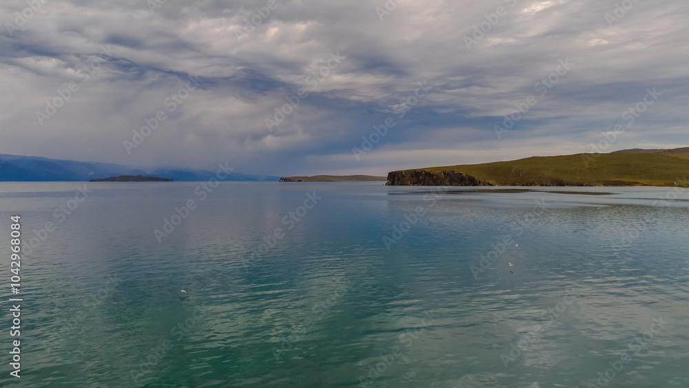 drone flight over the shore of Lake Baikal at sunset drone flight over the shore of Lake Baikal at sunset