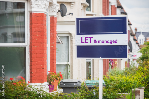 Estate agent sign Let and Managed displayed outside a terraced house in London photo