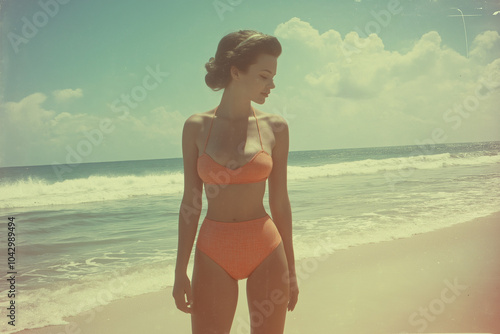 A woman in a bikini is standing on the beach during a hot summer day. Looking into the camera, old style