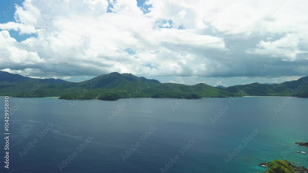 Drone journey from Hen and Chicken Islands back to the lush landscapes of Palawan, capturing dramatic mountain views and ocean expanses. Drone journey from Hen and Chicken Islands back to the lush landscapes of Palawan, capturing dramatic mountain views and ocean expanses.