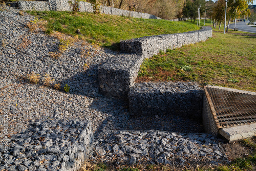 In a rugged and uneven landscape, a wellconstructed central drain efficiently manages water flow, effectively preventing flooding and excess water accumulation in the surrounding area photo