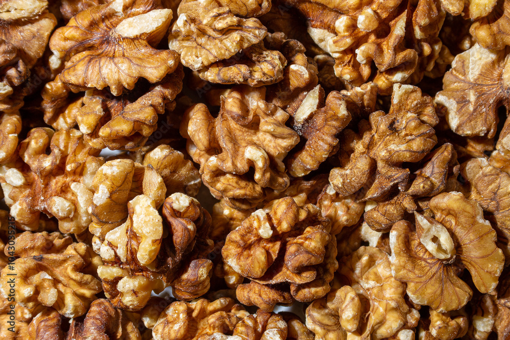 Scattered Shelled Walnuts. Background from Walnut. Natural High-Calorie Snacks Scattered Shelled Walnuts. Background from Walnut. Natural High-Calorie Snacks