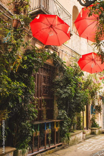 red umbrella on the street street in the town of Caltanissetta in Sicily