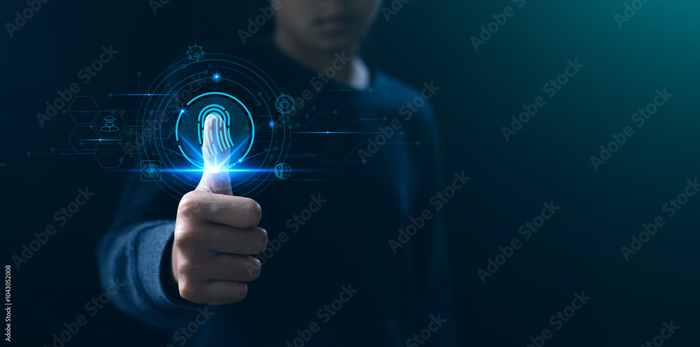 A person using biometric technology to scan their thumbprint, symbolizing security and advanced digital identification methods. A person using biometric technology to scan their thumbprint, symbolizing security and advanced digital identification methods.