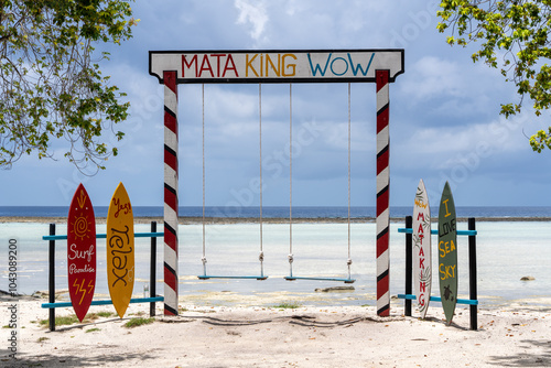 Tourist swing on beach sand with 