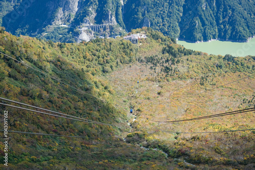 Kurobedaira Station, Tateyama, Toyama, Chubu, Japan, Aerial view of lush green terrain with mountains in the background photo