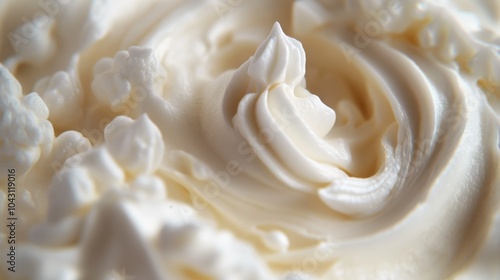 Close-up macro shot of whipped cream with a swirl in the center.