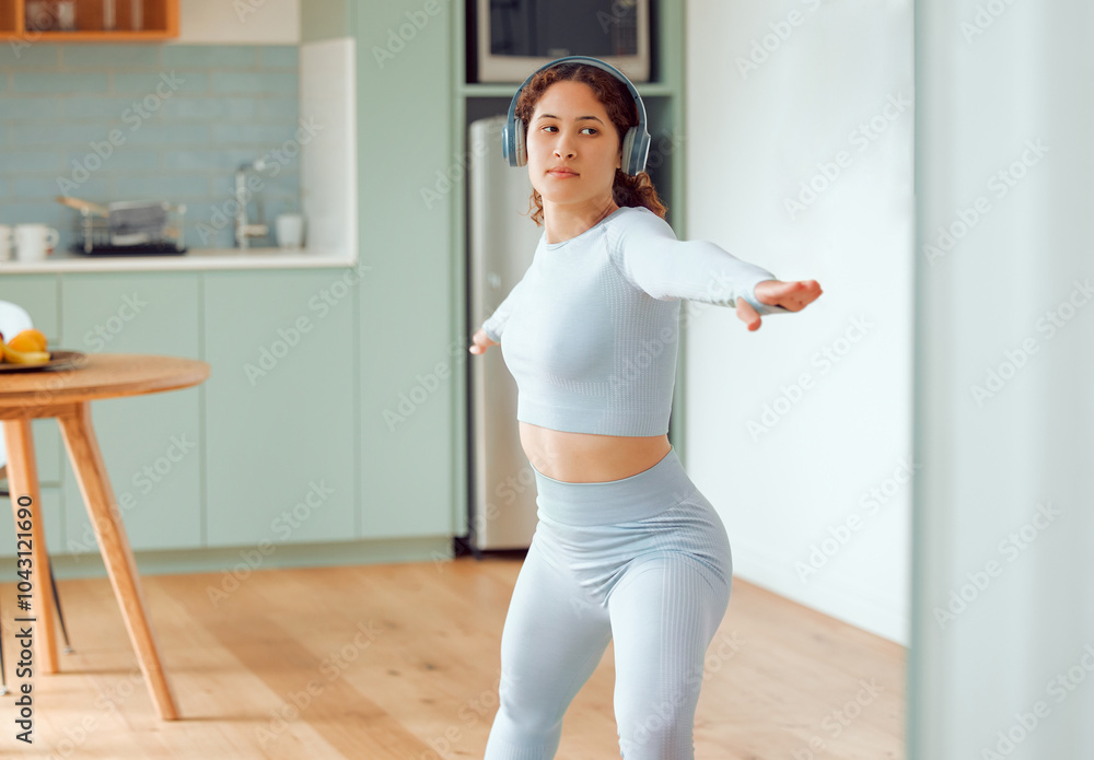 Fitness, exercise and woman in home with headphones, streaming app and yoga for morning body care. Music, podcast and girl listening to calm audio for pilates workout, stretching or gym in apartment Fitness, exercise and woman in home with headphones, streaming app and yoga for morning body care. Music, podcast and girl listening to calm audio for pilates workout, stretching or gym in apartment