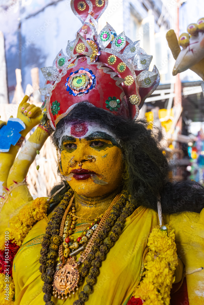 Kulasai Dasara, Portrait of indian woman with painted face and dressed as hindu god kali to perform the rituals of kulasai dasara cult festival of Tamil culture. Kulasai Dasara, Portrait of indian woman with painted face and dressed as hindu god kali to perform the rituals of kulasai dasara cult festival of Tamil culture.