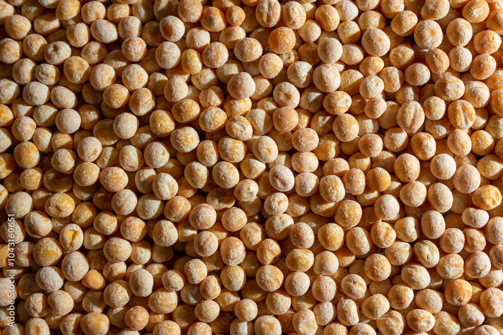 Uncooked Yellow Polished Peas Background. A Culinary Canvas of Dry Yellow Peas, Creating a Lively and Textured Background for Gourmet Cooking. Scattered Raw Polished Peas. Healthy Eating Ingredients Uncooked Yellow Polished Peas Background. A Culinary Canvas of Dry Yellow Peas, Creating a Lively and Textured Background for Gourmet Cooking. Scattered Raw Polished Peas. Healthy Eating Ingredients