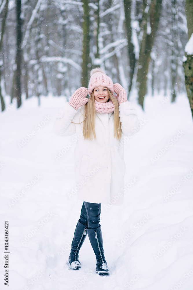 happy young woman walks through the forest near different trees, winter outdoors happy young woman walks through the forest near different trees, winter outdoors