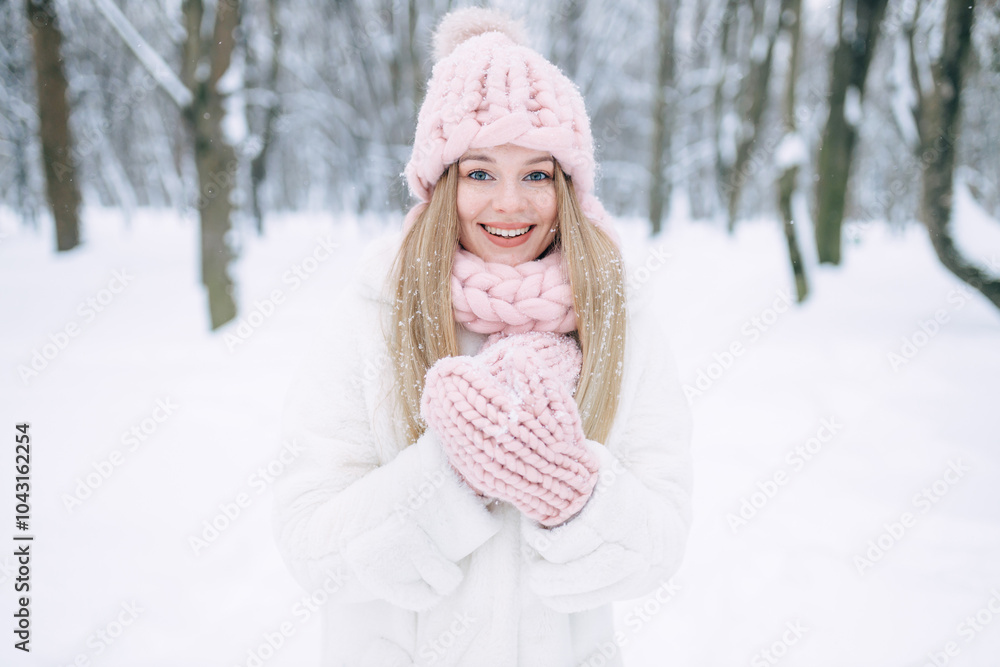 Happy woman walks in the snow in the park, beautiful view in winter. Happy woman walks in the snow in the park, beautiful view in winter.