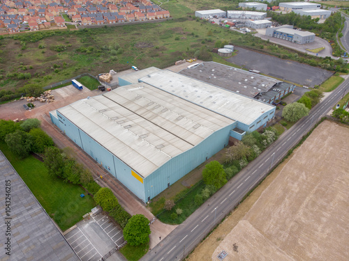 Obraz na płótnie Aerial drone photo of a large abandoned warehouse or factory building located in the town of Wakefield in West Yorkshire in the UK showing the large building and sorounding roads w salonie