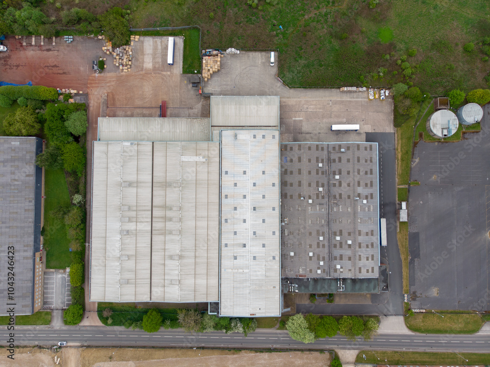 Aerial drone photo of a large abandoned warehouse or factory building located in the town of Wakefield in West Yorkshire in the UK showing the large building and sorounding roads