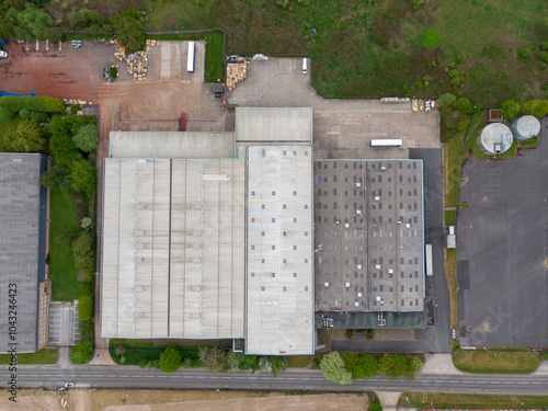 Obraz na płótnie Aerial drone photo of a large abandoned warehouse or factory building located in the town of Wakefield in West Yorkshire in the UK showing the large building and sorounding roads w salonie