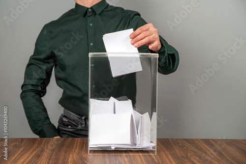 Принти на полотні A voter casting a ballot into a ballot box on election day