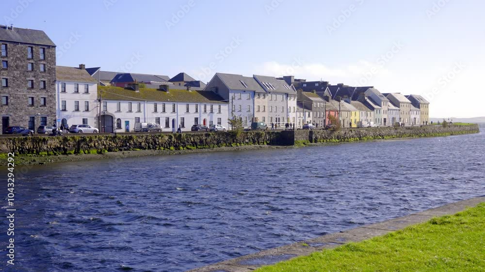 Galway Ireland The long Walk - A picturesque and charming view of a quaint coastal town featuring a row of colorful houses along the water Galway Ireland The long Walk - A picturesque and charming view of a quaint coastal town featuring a row of colorful houses along the water