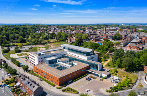 Obraz na płótnie Aerial photo of the Pontefract Hospital located in the village of Pontefract in Wakefield in the UK on a sunny summers day showing the Hospital and grounds with a blue sky and white clouds in the sky w salonie