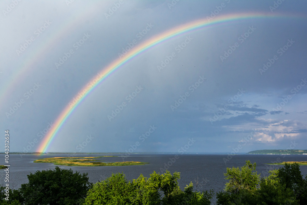 Naklejka premium double rainbow over the river