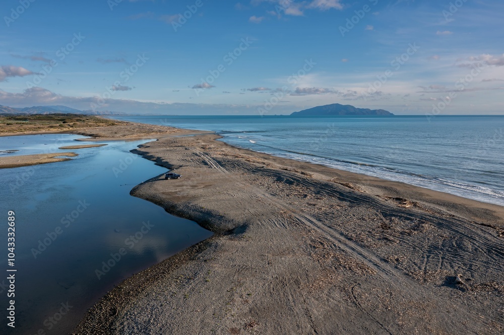 Serene coastal landscape with sandy beach and calm ocean waters. Serene coastal landscape with sandy beach and calm ocean waters.