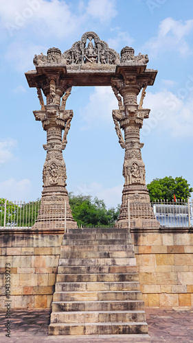 View of Kirti Toran, a pair of 12th-century columns, about 40 feet tall, Vadnagar, Mehsana, Gujarat, India. photo