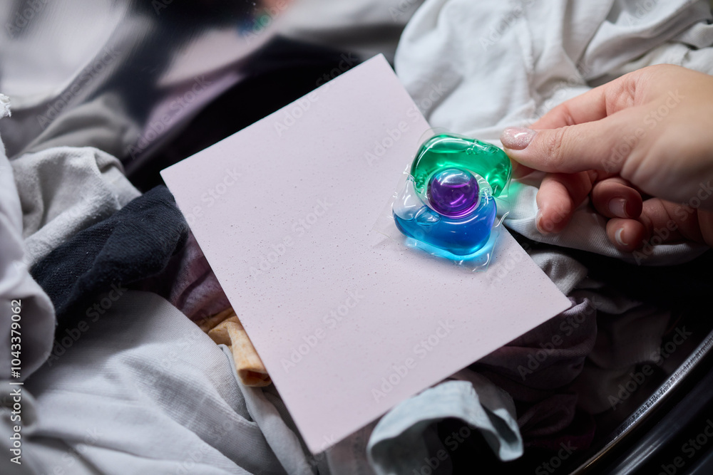 Using Laundry Detergent Pods While Doing Laundry in the Washing Machine with Clothes Using Laundry Detergent Pods While Doing Laundry in the Washing Machine with Clothes