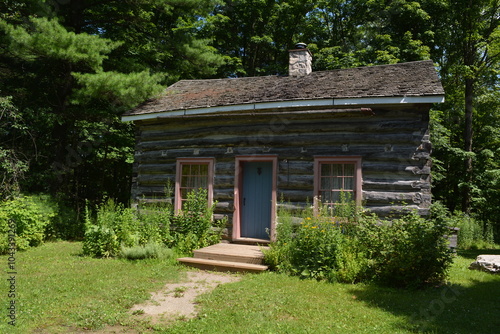 A log blacksmith's house built in the early 19th century in Canada.