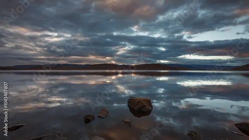 sunset, the movement of clouds reflected in the lake.