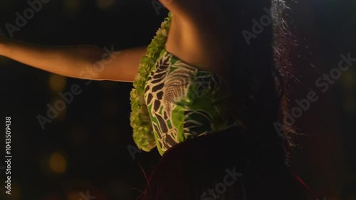 Hula dancer performing with red feathered poi balls in Hawaii, USA in 4K slow motion 60fps