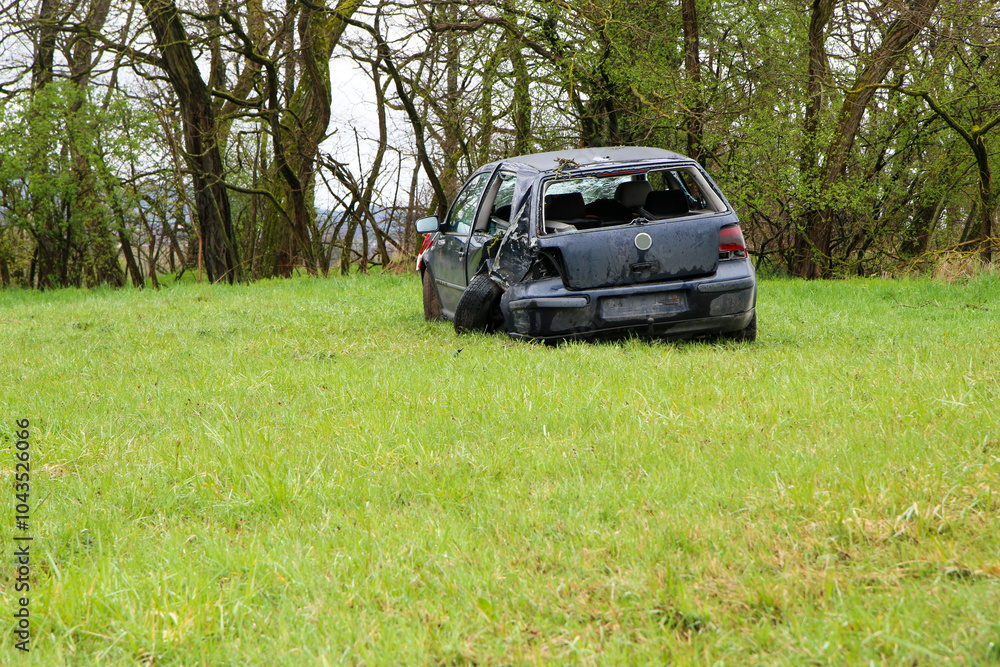 Abandoned car standing by the road after the traffic accident. Completely destroyed and wrecked. Abandoned car standing by the road after the traffic accident. Completely destroyed and wrecked.