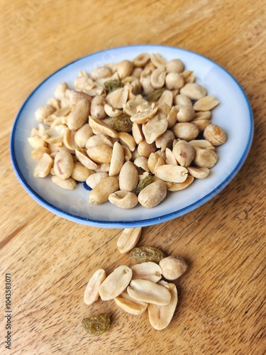 Peanut nut and dried fruit on wood background